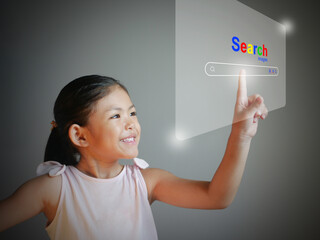 A little girl is using the Search virtual screen to searching for information. Online Search...