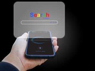 A man's hand use smartphones to searching for information data on the internet networking. Search website browser on virtual screen popping up. Global network, search engine optimization technology