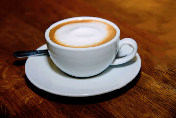 cup of coffee on wooden table
