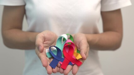 World cancer day, February 4. Colorful ribbons for supporting people living and illness. Healthcare, fighting, medical and National Cancer Survival day, Autism awareness day concept - Powered by Adobe