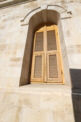 A small window in a residential building in a big city