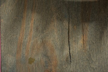 Naklejka premium Plywood is a destroyed wood layer. Dark wood background - abstract pattern of cracks