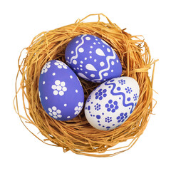 Colorfully painted easter egg in the nest