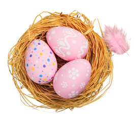 Colorfully painted easter egg in the nest