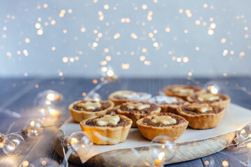Christmas mince pies with fruit filling on a gray background.