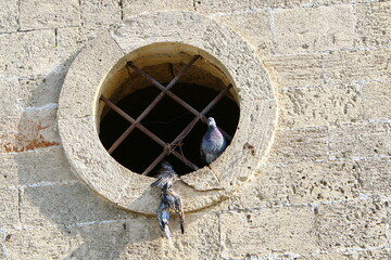 A small window in a residential building in a big city