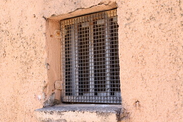 A small window in a residential building in a big city