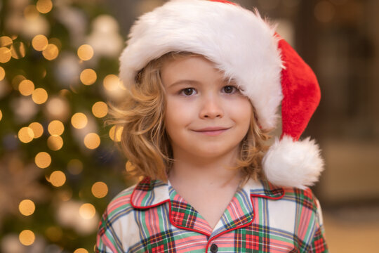 Close up portrait, funny kids face. Child preparing for the Christmas and New Year holidays.