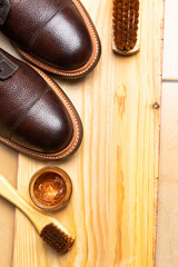 Close Up of Various Shoes Cleaning Accessories for Dark Brown Grain Brogue Derby Boots Made of Calf Leather with Special Tools.