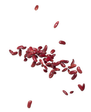Red Bean flying explosion, red grain beans explode abstract cloud fly. Beautiful complete seed pea bean splash in air, food object design. Selective focus freeze shot white background isolated