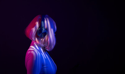Woman in headphones listening music and enjoing