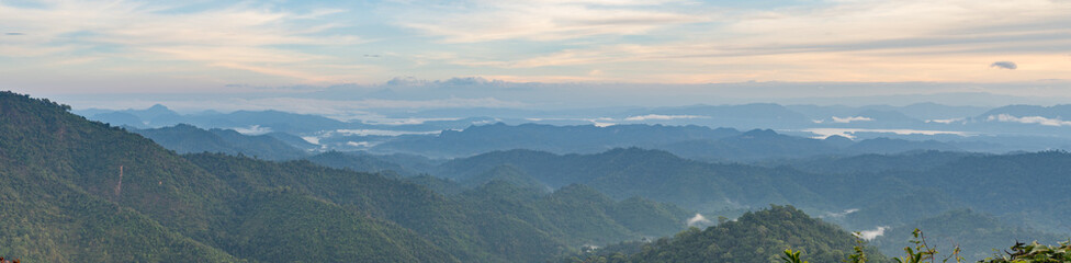 Panorama Landscape nature Mountains and trees with beautiful clouds and sky in sunrise.