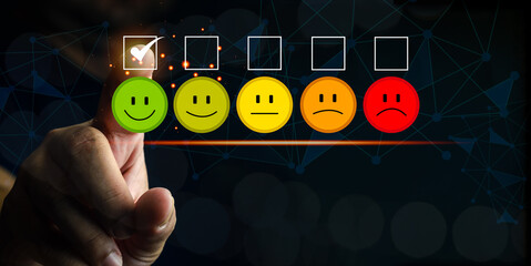 Client pressing smiley face emoticon on the digital touch screen for service evaluation. Customer...