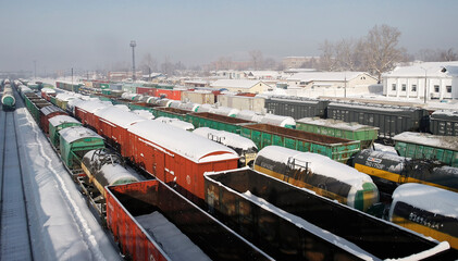 Freight wagons on railway station. Industrial background. Winter, snow. Ust-Kamenogorsk (kazakhstan)