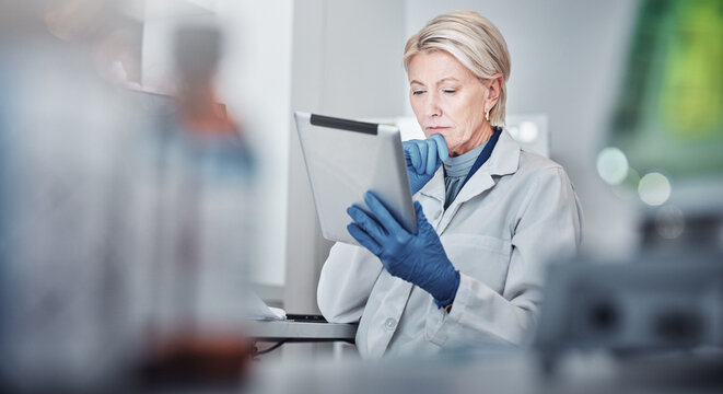 Tablet, thinking and science with a doctor woman at work in a lab for research, innovation or development. Healthcare, medical and idea with a senior female scientist working in a laboratory - Powered by Adobe