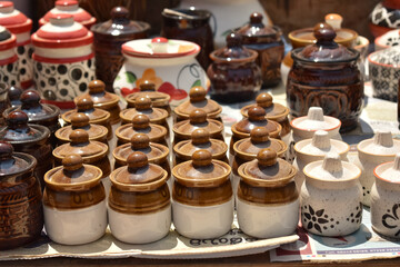 A closeup selective focus picture of hand made Porcelain or terracotta  jars for sale in India