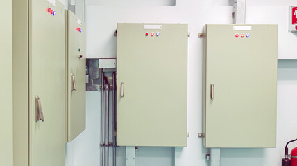 The power control room inside the building has a sizable power distribution control cabinet installed. technologies, industrial, and energy-saving ideas.
