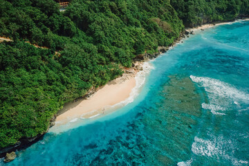 Beautiful beach with tropical ocean in Bali. Aerial view of Green bowl beach