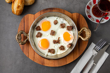 Turkish scrambled eggs Turkish name Kavurmali Yumurta with roasted meat in copper pan