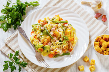 Ham and Noodle Casserole on white plate, top view