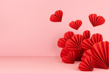 Passion Valentines day stage with levitate red hearts of paper on soft light pink color as border,...