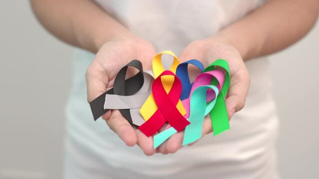 World cancer day, February 4. Colorful ribbons for supporting people living and illness. Healthcare, fighting, medical and National Cancer Survival day, Autism awareness day concept