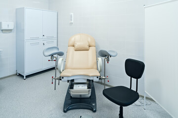 Modern gynecological office with chair for doctor and patient and checking equipment