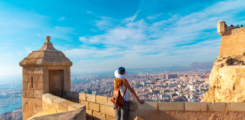 woman tourist looking at panoramic view of Alicante city,  Spain