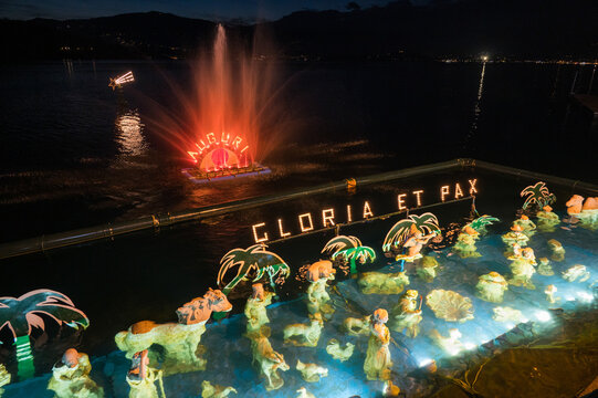 Christmas crib submerged and illuminated by colored lights in the water of Lake Maggiore in Laveno