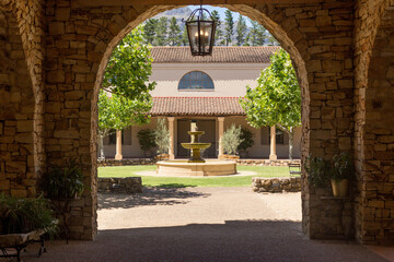 Fototapeta premium arch with a view of the garden and fountain