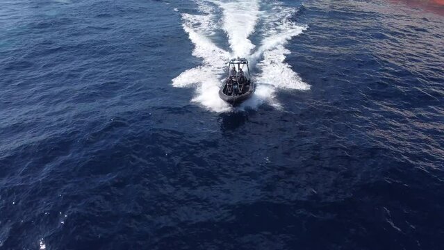 Fantastic aerial shot from the bow of a high-speed boat of the National Customs Police. Customs police against drug trafficking.