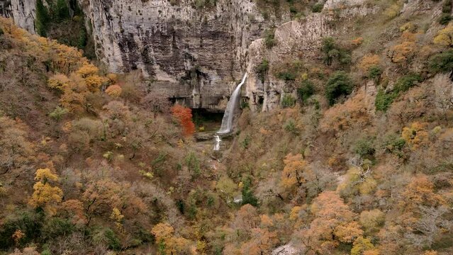 Flying towards the Artazul Waterfall in autumn. Arteta. Ollo Valley