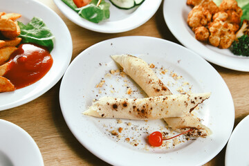 kebab, Burger and salads on the table