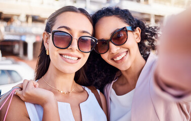 Selfie, women or friends shopping in city, smile or wealth for luxury clothes, boutique or sale. Customers, ladies or girls with bags, sunglasses or clients with social media, rich or happy in street