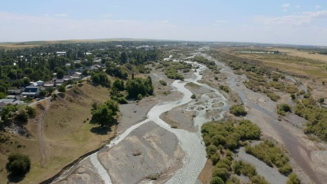 Badam river in the city of Shymkent. river with drinking water in the South Kazakhstan region. mountain water for agriculture and animal husbandry in shymkent