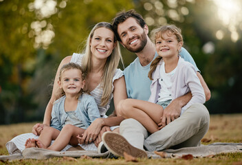 Family, park picnic and portrait with smile, love and happiness for bonding on blanket, grass and...