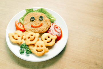 schnitzel and garnish on a dish in a children's restaurant
