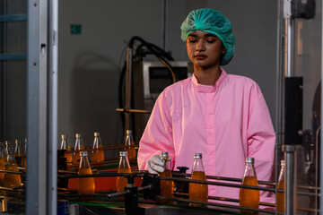 Soft drink factory workers production control production line