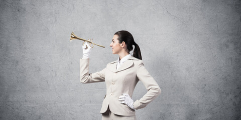 Woman playing trumpet brass instrument