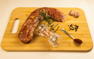 wooden board with spices to marinate pork tenderloin