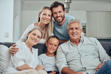 Portrait of grandparents, parents and child on sofa enjoying holiday, weekend and quality time...