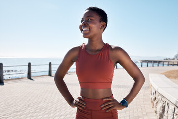 Fototapeta na wymiar Black woman runner, smile and happy by sea promenade for health, fitness and summer body goals. Happy running workout, training and exercise by ocean for wellness, muscle and development in Sydney