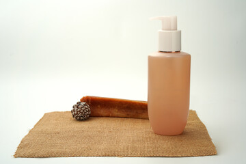 facial clean bottle on natural beige background