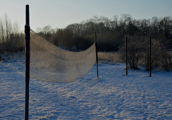 playing net on the lawn football field, badminton, tennis court, in the countryside at the cottage in the school in the yard, forest nursery for children, summer camp in the mountains  in winter, snow