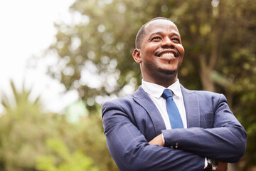 Business, black man and leader crossed arms, outdoor and thinking for startup company. Young male...