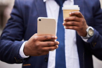 Businessman, hands and coffee with phone for communication on email, social media or networking. Travel, 5g and corporate black man on work commute with mobile app connection and latte drink.