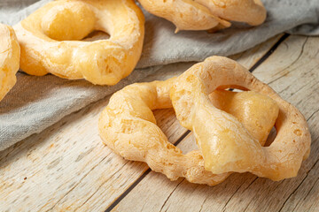 biscoito de polvilho (or manioc biscuit in english) over wooden table.