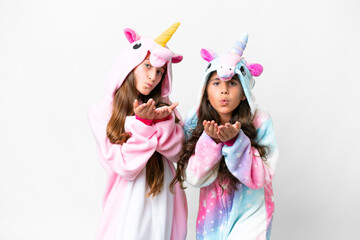 Friends girls with unicorn pajamas over isolated white background