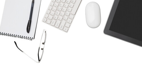 Office workplace with wooden table and office supplies tablet