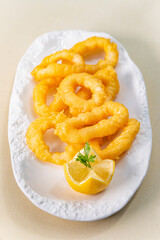 Freshly made Roman calamars with lemon wedge
